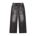 Wide-leg black jeans with a faded effect and subtle whiskering on the thighs.