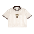 Cream shirt with dark striped collar and sleeves, featuring "AIRAMAK RACING" logo on front.