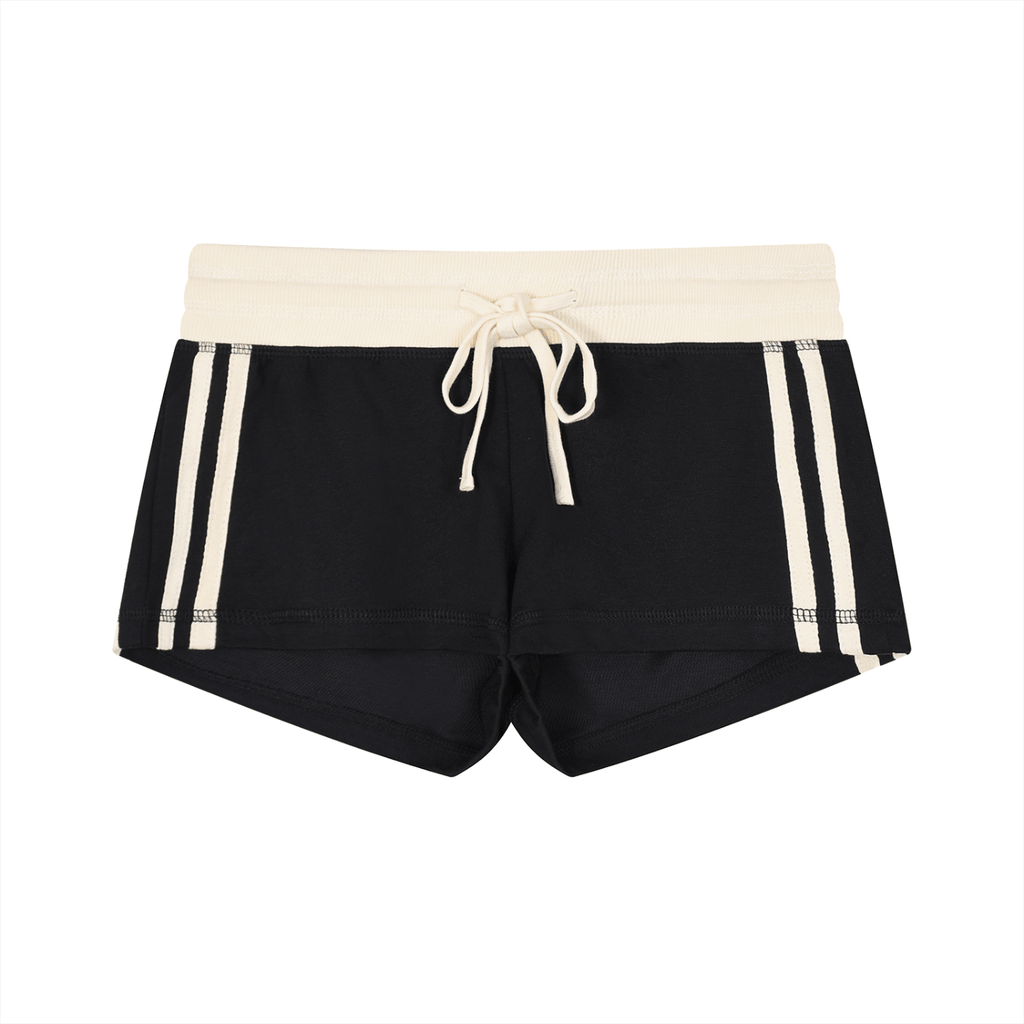 Black shorts with a cream waistband and drawstring, featuring three cream stripes on each side.