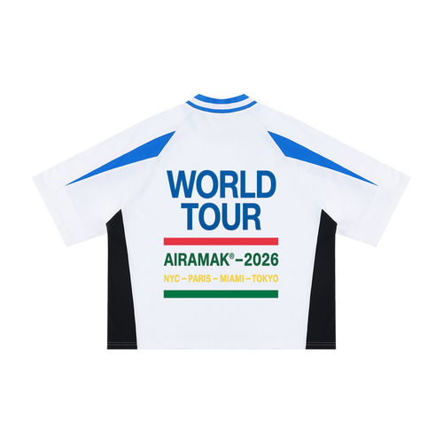 White jersey with blue accents, "World Tour AIRAMAK 2026" text, cities listed below.