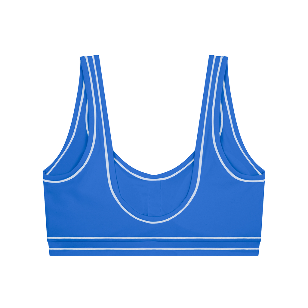 Blue sports bra with white trim, scoop neck, and double shoulder straps on a white background.