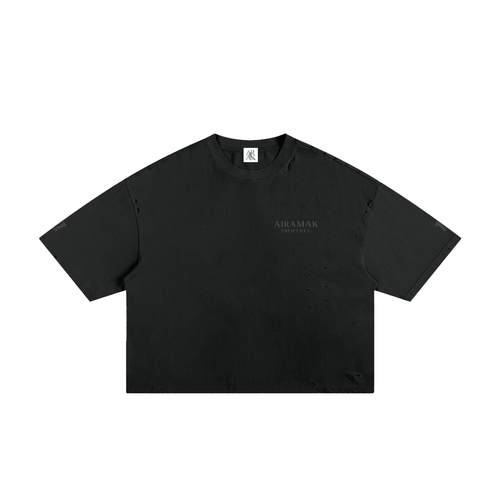 Black oversized T-shirt with short sleeves, crew neck, and subtle logo on the front.