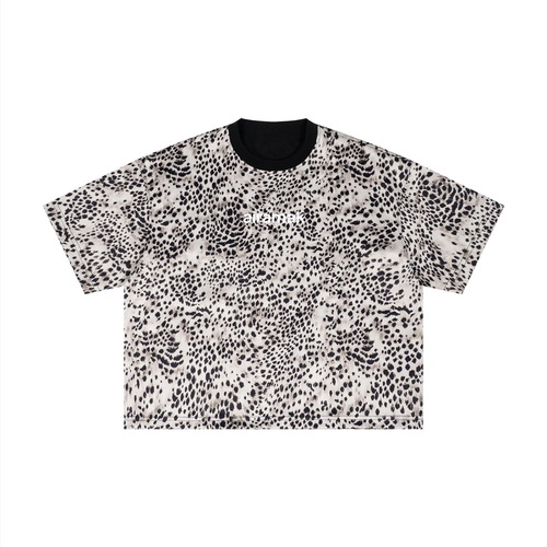 Short-sleeve shirt with black and white abstract dotted pattern, black collar.