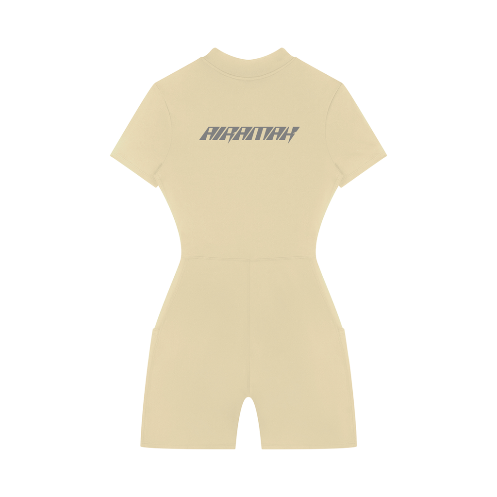 Beige short-sleeve romper with "AIRWALK" text on the back, featuring a fitted waist.