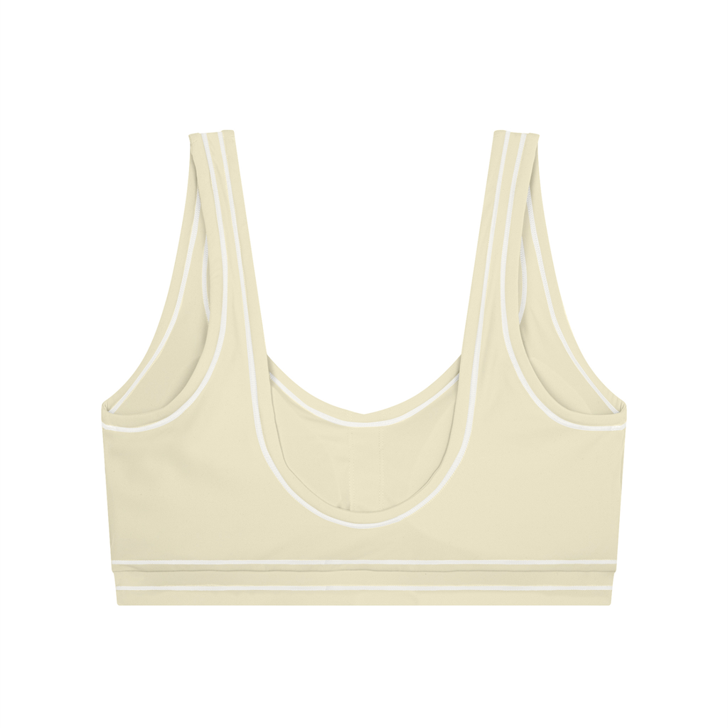 Beige sports bra with white trim, featuring a scoop neckline and racerback design.