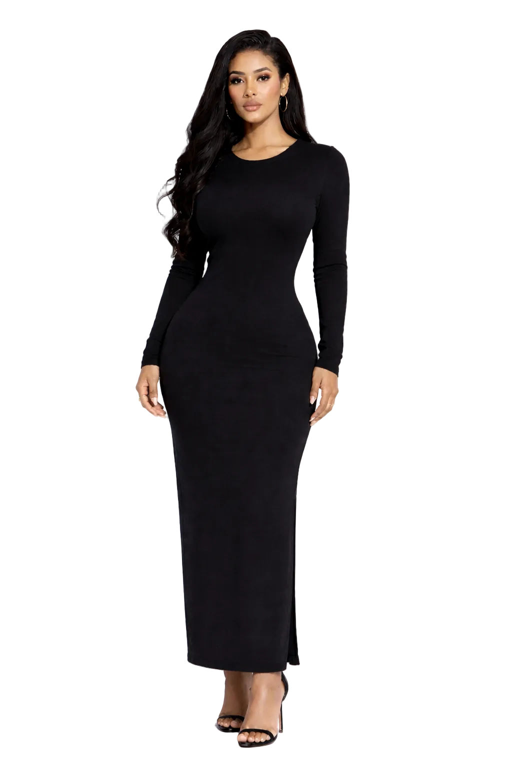 Woman in a long, form-fitting black dress with long sleeves, wearing black heels. White background.