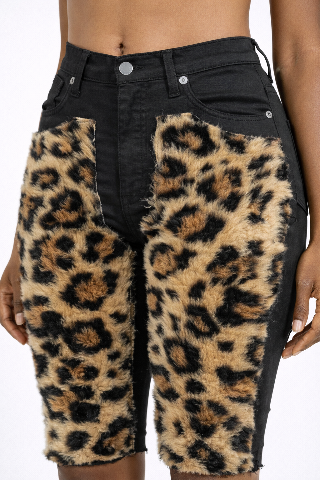 Black high-waisted shorts with leopard print faux fur patches on the front.