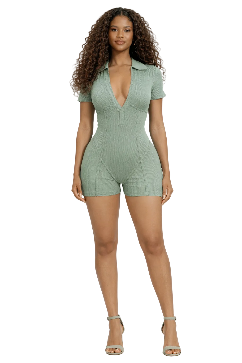 Woman in a light green romper with short sleeves and a collar, wearing matching heels.