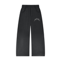 Black wide-leg pants with white text on the thigh, featuring an elastic waistband and front pockets.