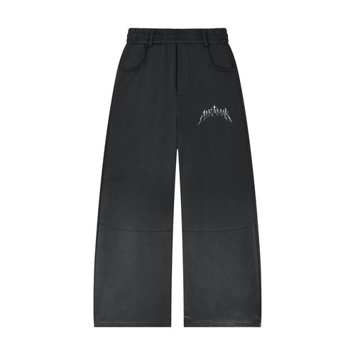 Black wide-leg pants with white text on the thigh, featuring an elastic waistband and front pockets.