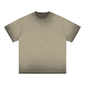Beige T-shirt with a faded, worn texture and short sleeves, displayed against a white background.