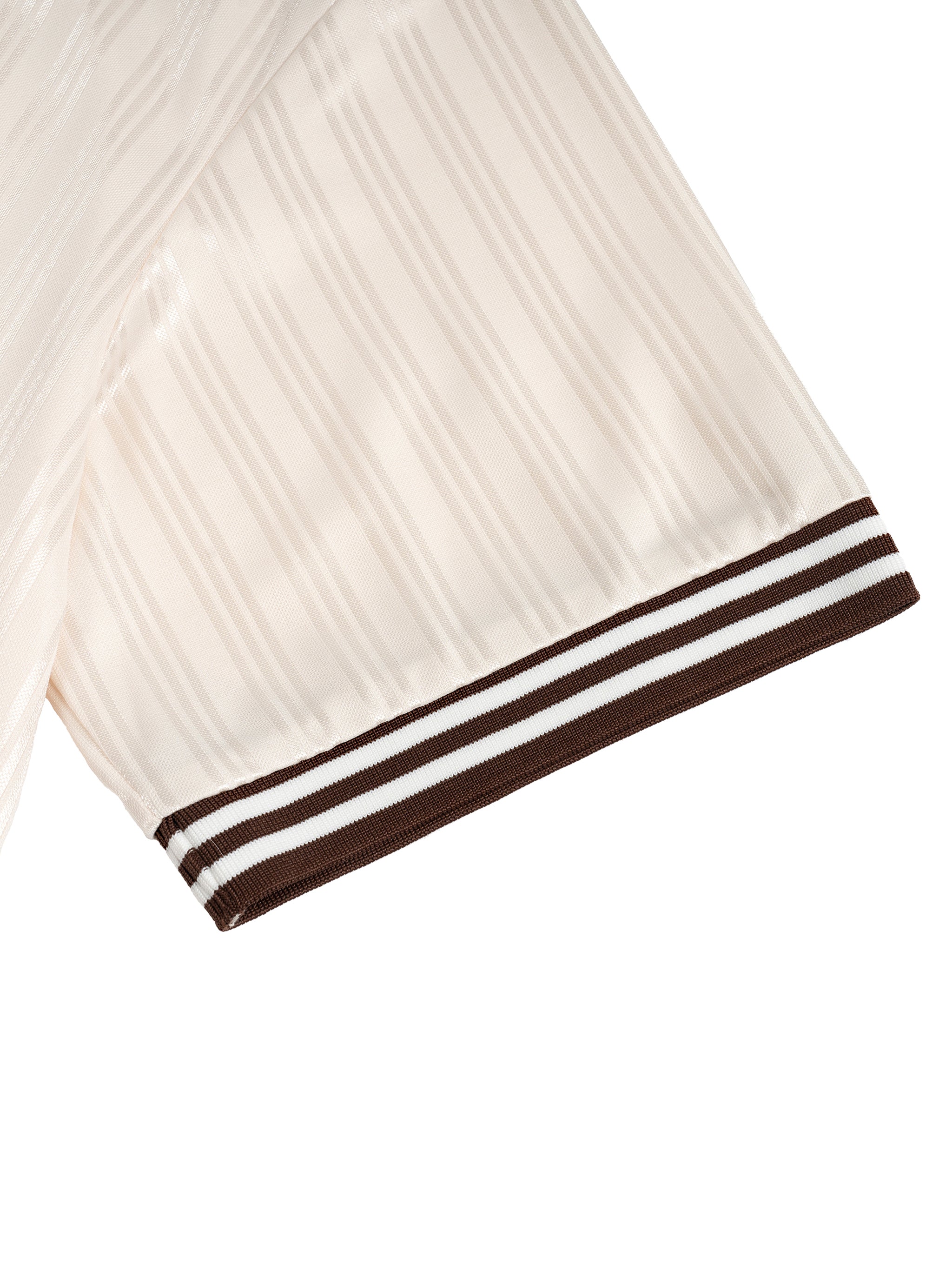 Close-up of a beige fabric with subtle vertical stripes and a brown-striped edge.