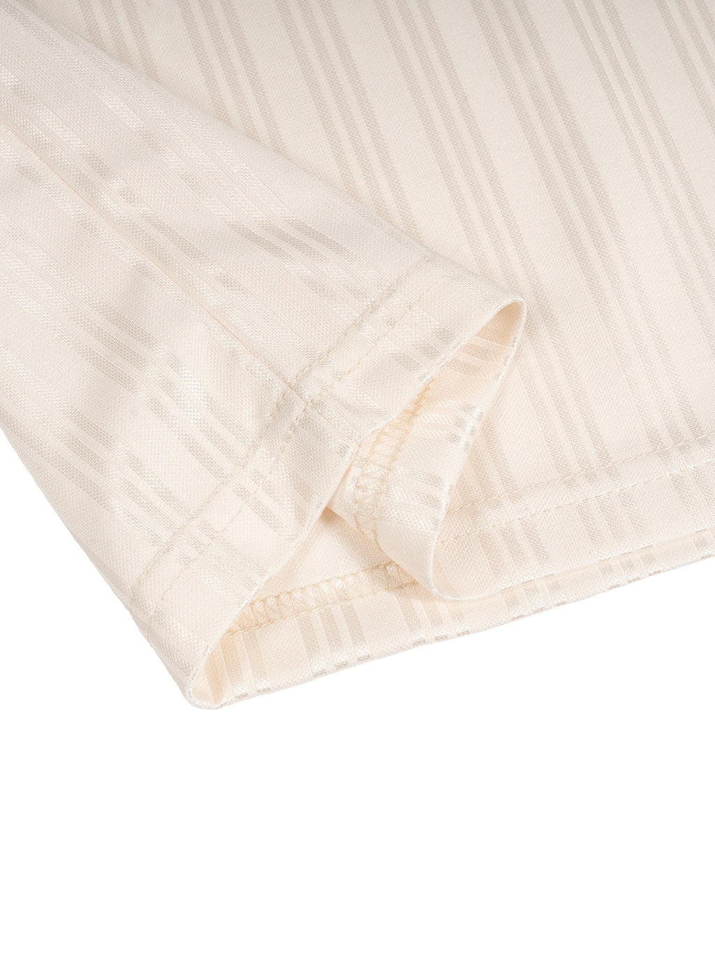 Close-up of beige fabric with subtle vertical stripes and visible stitching on the edge.