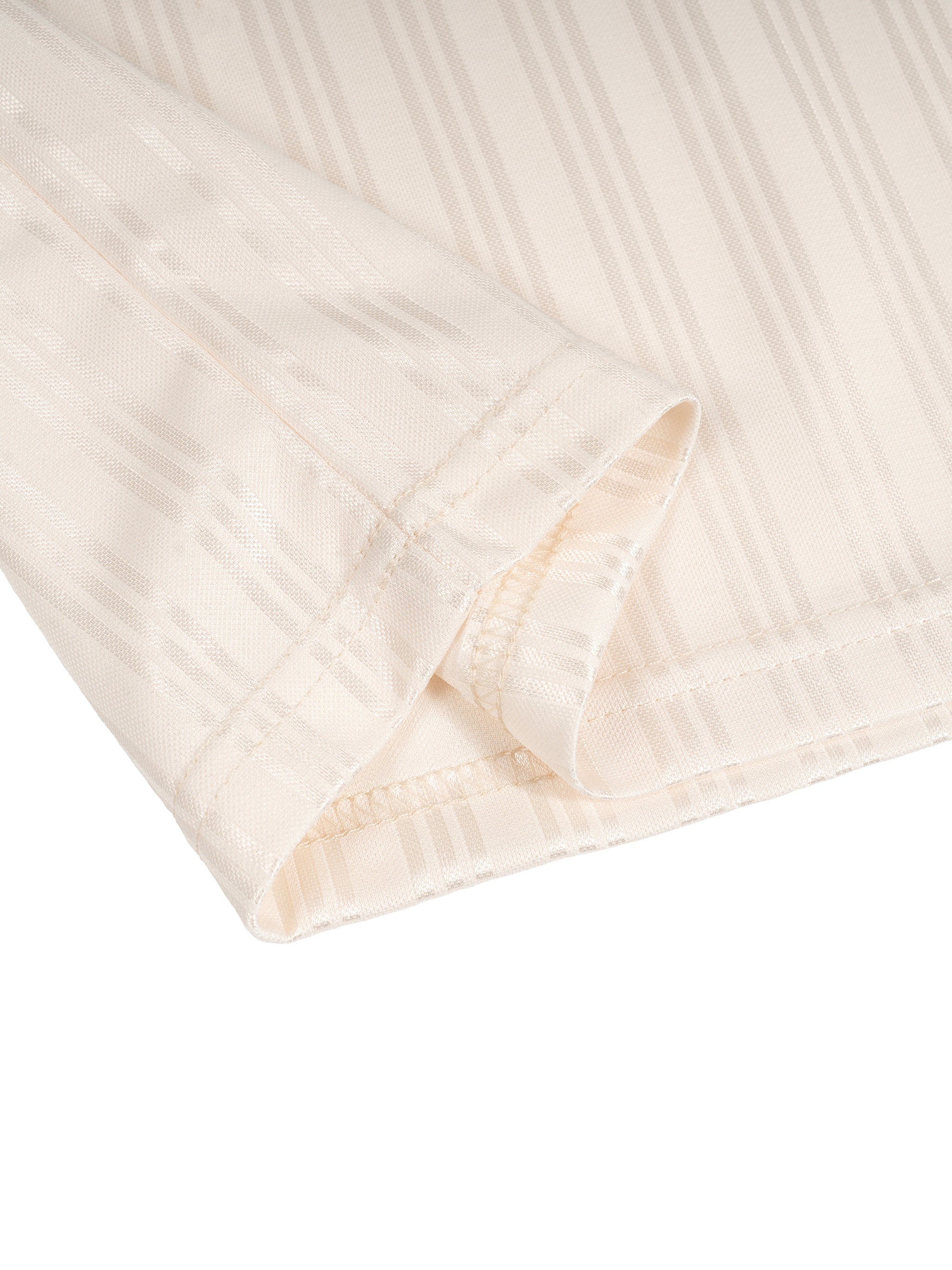 Close-up of beige fabric with subtle vertical stripes and visible stitching on the edge.