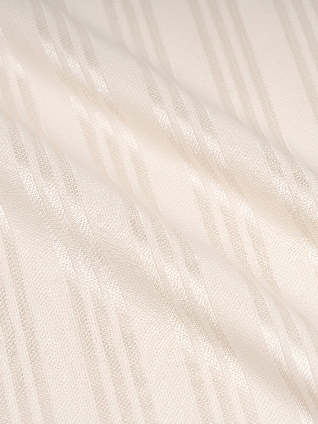 Cream fabric with subtle vertical stripes and a slight sheen. Texture appears smooth and soft.