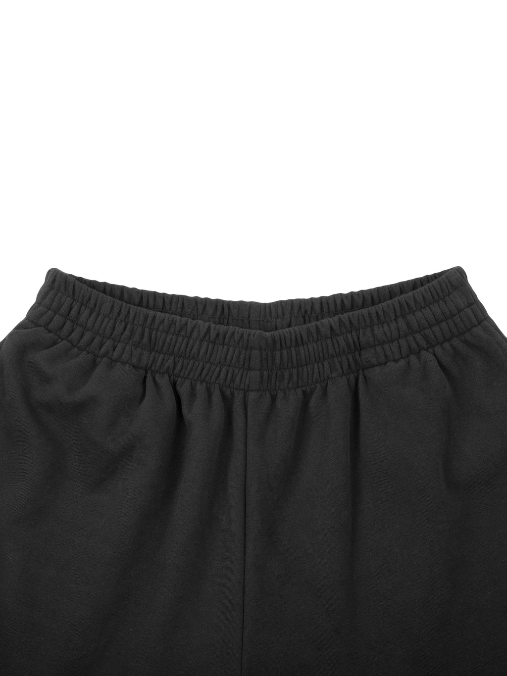 Black pants with an elastic waistband, gathered fabric, and smooth texture.