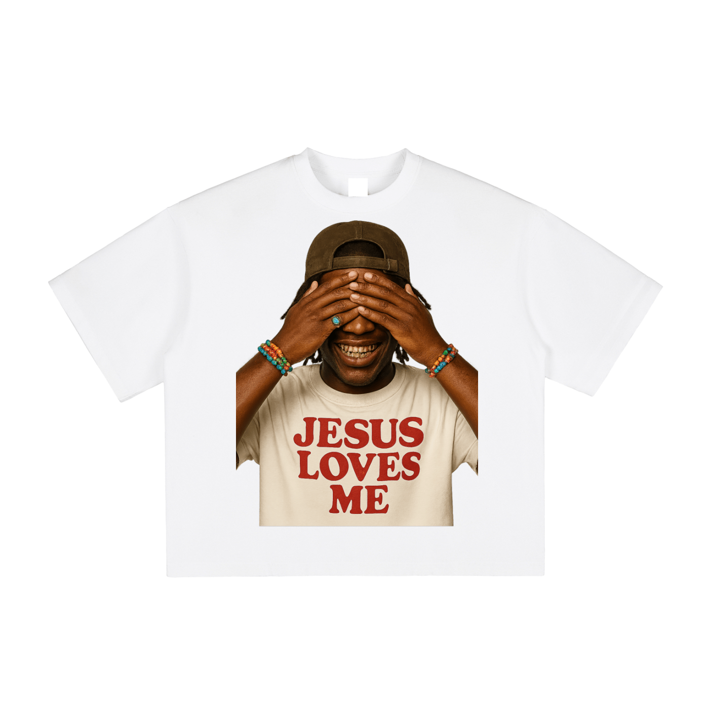 Smiling person in a cap, covering eyes, wearing a "Jesus Loves Me" shirt, colorful bracelets.
