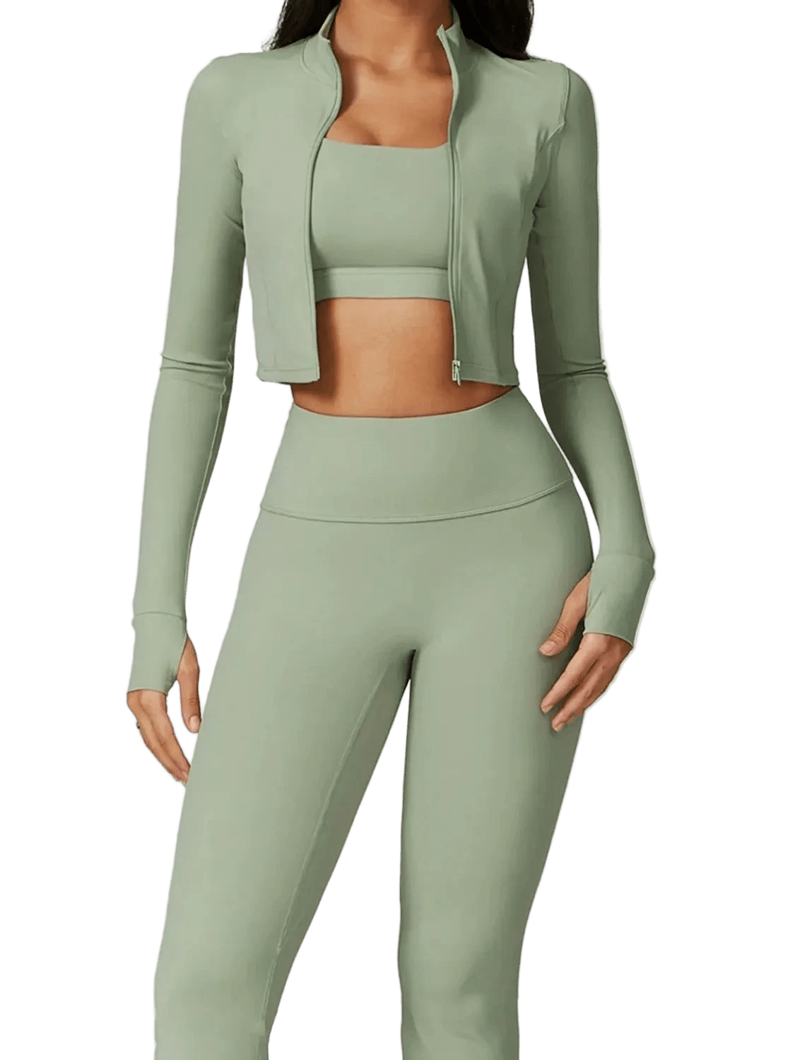 Woman in a sage green athleisure set with a cropped jacket and high-waisted leggings.
